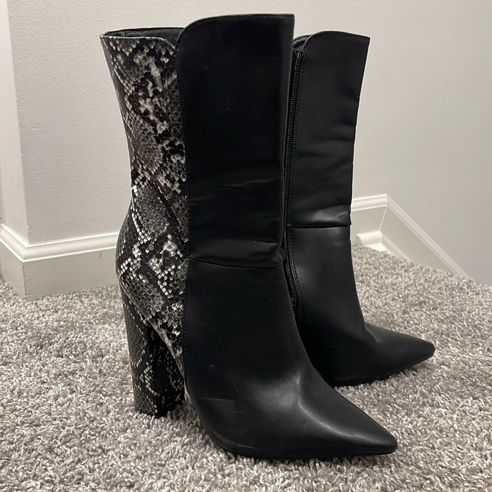 Black snakeskin boots.